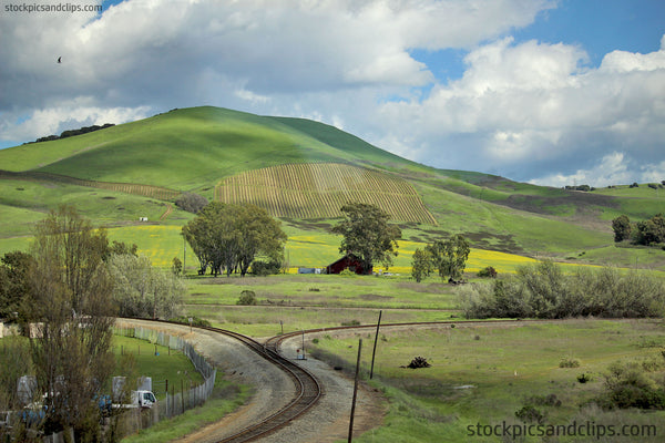 Northern California Railroad Tracks Split Hills Crops Clouds