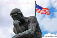 Statue The Thinker and the U.S. Flag